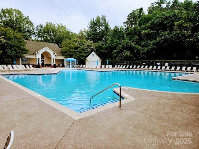 18605 Ruffner Dr Unit 3E, Cornelius, NC 28031 - community pool with a patio area and view of wooded area