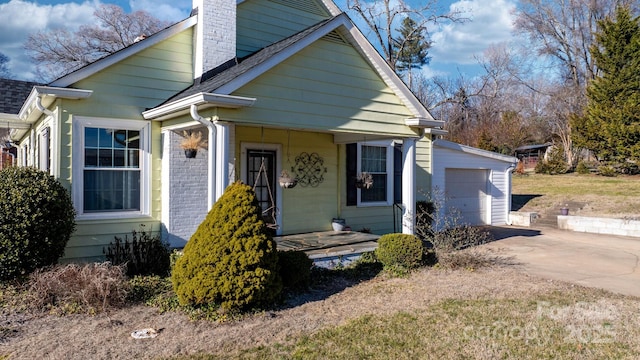 98 S Main St, Granite Falls, NC 28630 - view of front of house featuring driveway, a chimney, and an attached garage