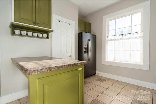 98 S Main St, Granite Falls, NC 28630 - kitchen featuring stainless steel refrigerator with ice dispenser, green cabinets, and baseboards