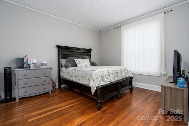 98 S Main St, Granite Falls, NC 28630 - bedroom with hardwood / wood-style flooring, crown molding, a textured ceiling, and baseboards