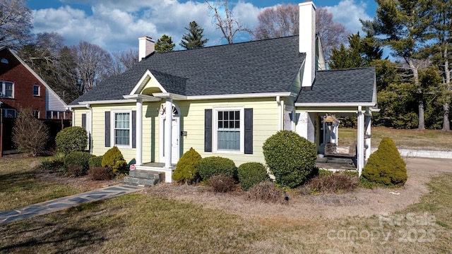 98 S Main St, Granite Falls, NC 28630 - view of front facade with a chimney, a front lawn, and roof with shingles
