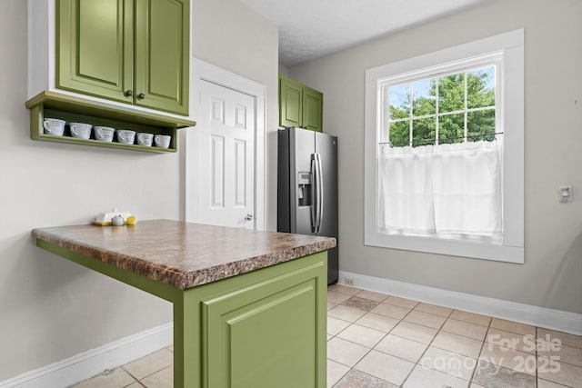 98 S Main St, Granite Falls, NC 28630 - kitchen with green cabinets, stainless steel refrigerator with ice dispenser, light tile patterned floors, open shelves, and dark countertops
