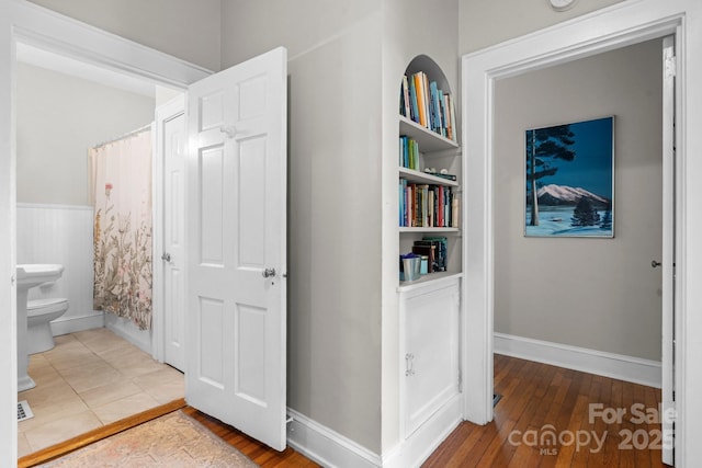 98 S Main St, Granite Falls, NC 28630 - corridor featuring wood finished floors and built in shelves