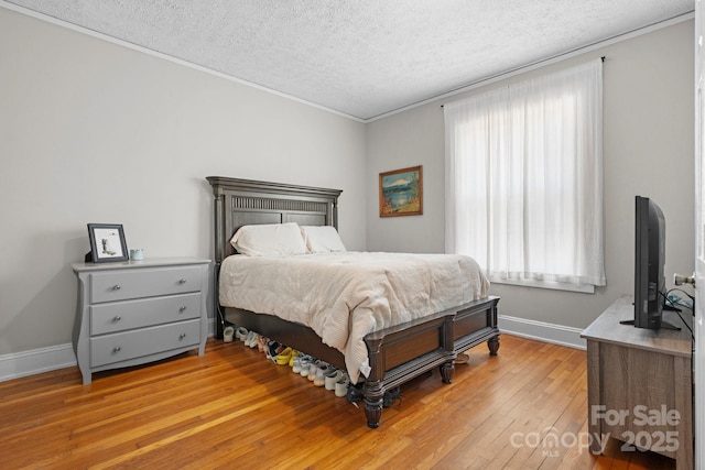 98 S Main St, Granite Falls, NC 28630 - bedroom with a textured ceiling, hardwood / wood-style floors, and ornamental molding