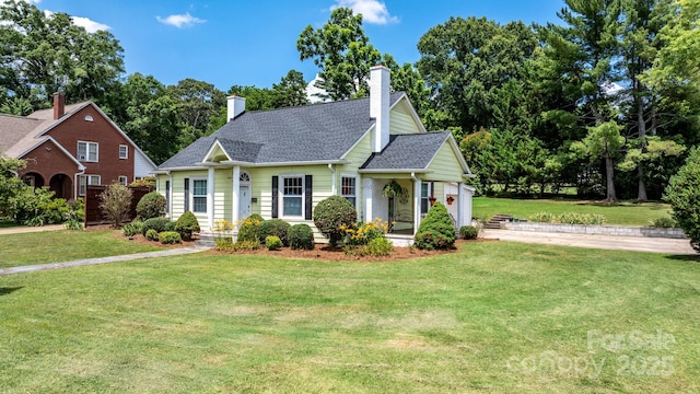 98 S Main St, Granite Falls, NC 28630 - view of front of home featuring a front lawn, roof with shingles, and a chimney