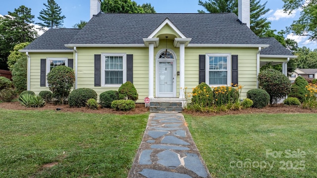 98 S Main St, Granite Falls, NC 28630 - bungalow-style house with a chimney, a front lawn, and a shingled roof
