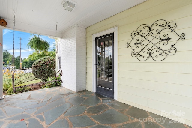 98 S Main St, Granite Falls, NC 28630 - entrance to property featuring brick siding and covered porch