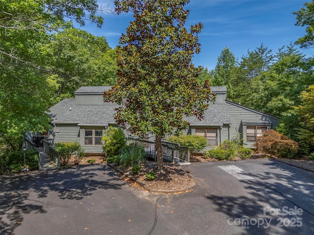 128 Quail Run Ct Unit 1627, Lake Lure, NC 28746 - view of front of house with roof with shingles and asphalt driveway