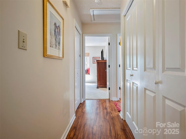 128 Quail Run Ct Unit 1627, Lake Lure, NC 28746 - corridor with dark wood-style floors, baseboards, and attic access