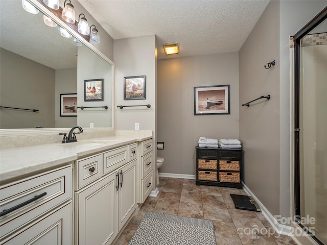 128 Quail Run Ct Unit 1627, Lake Lure, NC 28746 - full bath with vanity, a textured ceiling, toilet, a shower with shower door, and baseboards