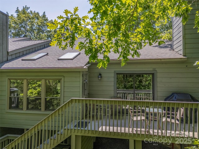 128 Quail Run Ct Unit 1627, Lake Lure, NC 28746 - back of house with a shingled roof, a deck, stairway, and a chimney