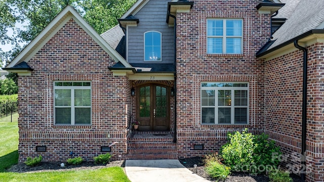 73 41st Ave NW, Hickory, NC 28601 - property entrance featuring crawl space, french doors, brick siding, and a shingled roof
