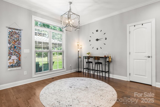 73 41st Ave NW, Hickory, NC 28601 - dining room featuring a chandelier, crown molding, wood finished floors, and baseboards