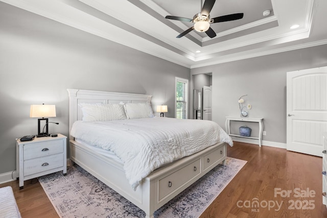 73 41st Ave NW, Hickory, NC 28601 - bedroom with crown molding, wood finished floors, baseboards, a raised ceiling, and recessed lighting