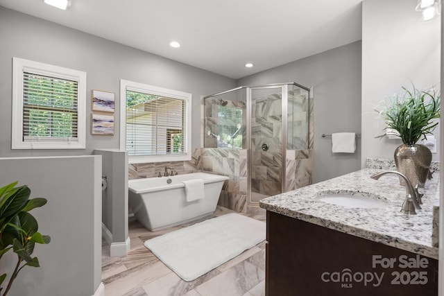 73 41st Ave NW, Hickory, NC 28601 - bathroom featuring a shower stall, a freestanding bath, double vanity, marble finish floors, and recessed lighting