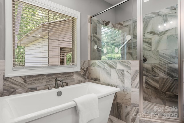 73 41st Ave NW, Hickory, NC 28601 - bathroom with a freestanding tub, a shower stall, and tile walls