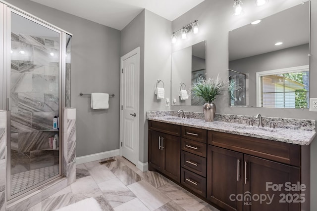 73 41st Ave NW, Hickory, NC 28601 - full bath with double vanity, a shower stall, baseboards, and marble finish flooring