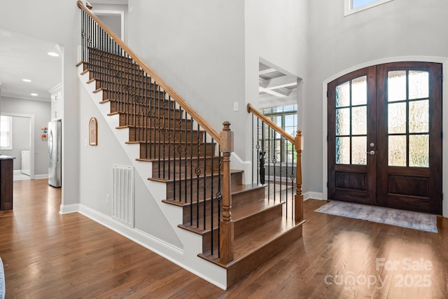 73 41st Ave NW, Hickory, NC 28601 - entrance foyer with french doors, wood finished floors, stairs, baseboards, and recessed lighting