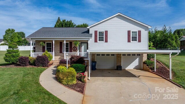 10 Hunters Ridge Ct, Granite Falls, NC 28630 - split level home featuring brick siding, a porch, a front yard, and a garage