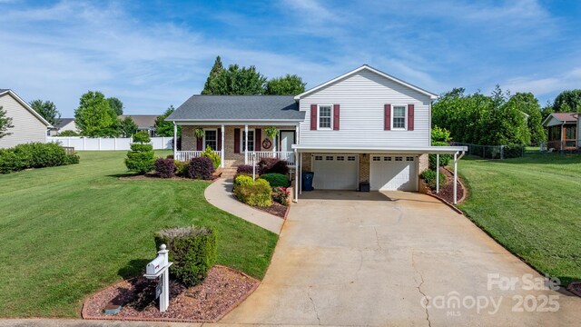 10 Hunters Ridge Ct, Granite Falls, NC 28630 - tri-level home featuring a porch, brick siding, a garage, driveway, and roof with shingles