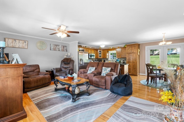 10 Hunters Ridge Ct, Granite Falls, NC 28630 - living room with a chandelier, a ceiling fan, light wood-style flooring, crown molding, and baseboards