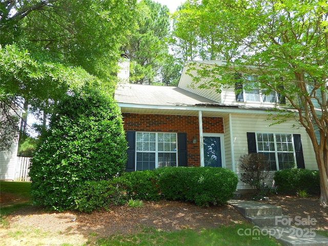 9139 Charminster Ct, Charlotte, NC 28269 - view of front of home featuring a chimney