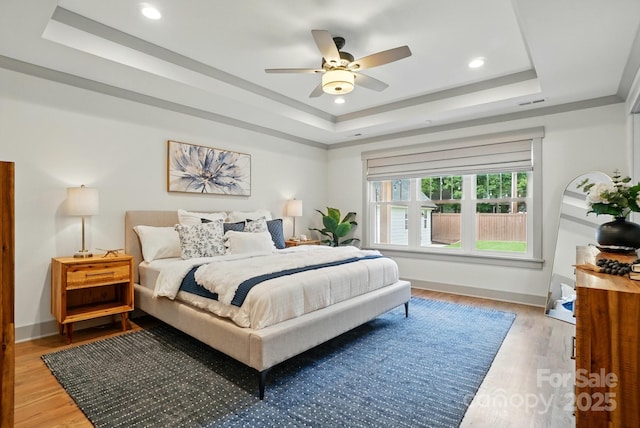 343 Melbourne Ct, Charlotte, NC 28209 - bedroom featuring a tray ceiling, light wood-style floors, recessed lighting, a ceiling fan, and baseboards