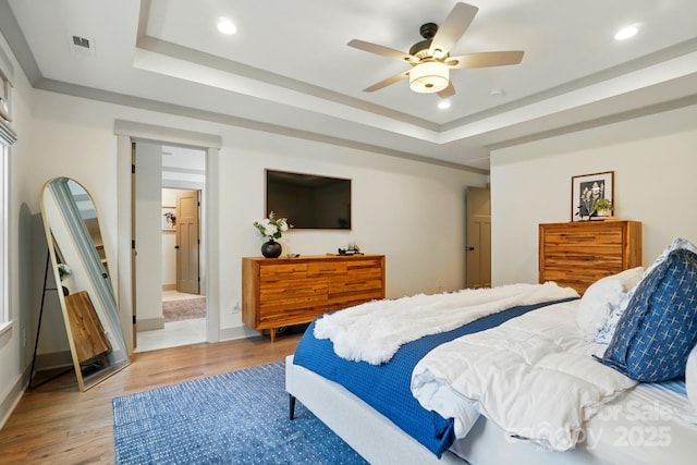 343 Melbourne Ct, Charlotte, NC 28209 - bedroom featuring a tray ceiling, light wood-style flooring, recessed lighting, and baseboards