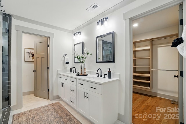 343 Melbourne Ct, Charlotte, NC 28209 - full bath featuring double vanity, a walk in closet, and baseboards