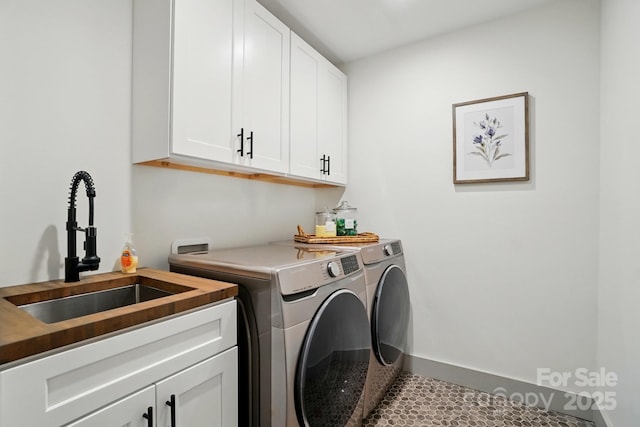 343 Melbourne Ct, Charlotte, NC 28209 - laundry room featuring washer and clothes dryer and cabinet space