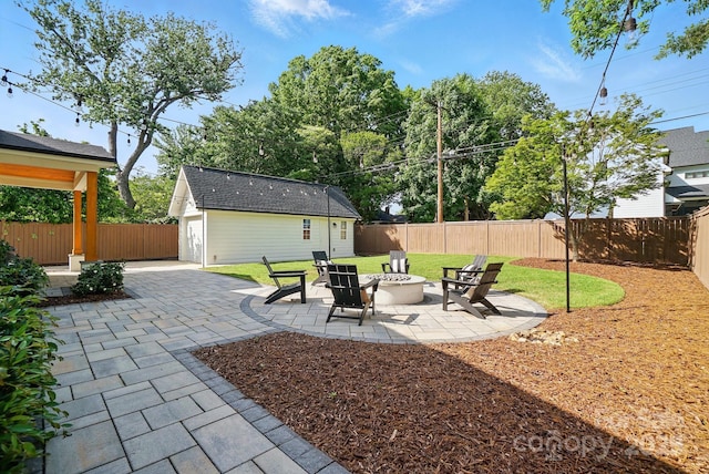 343 Melbourne Ct, Charlotte, NC 28209 - view of patio featuring an outbuilding and a fire pit