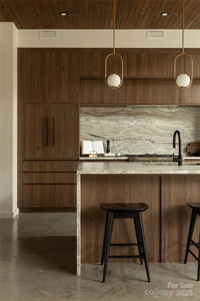 161 Church St Unit 305, Asheville, NC 28801 - bar with concrete floors, decorative light fixtures, wooden ceiling, and tasteful backsplash