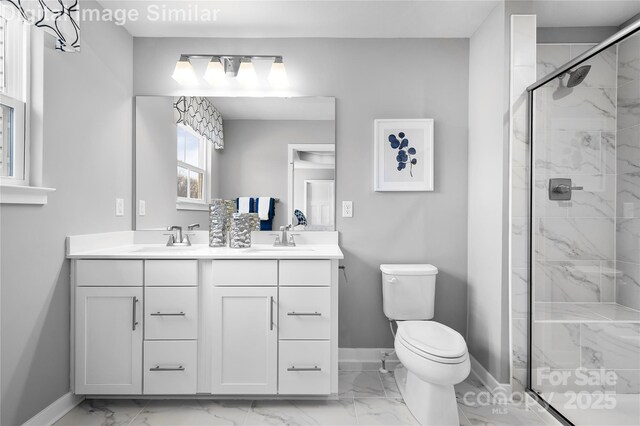 7335 Childress Dr, Concord, NC 28025 - bathroom featuring marble look tile flooring, baseboards, double vanity, toilet, and a marble finish shower
