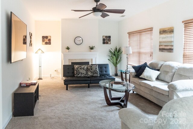 435 Riverwalk Dr NW, Concord, NC 28027 - carpeted living room featuring ceiling fan, a fireplace, and baseboards