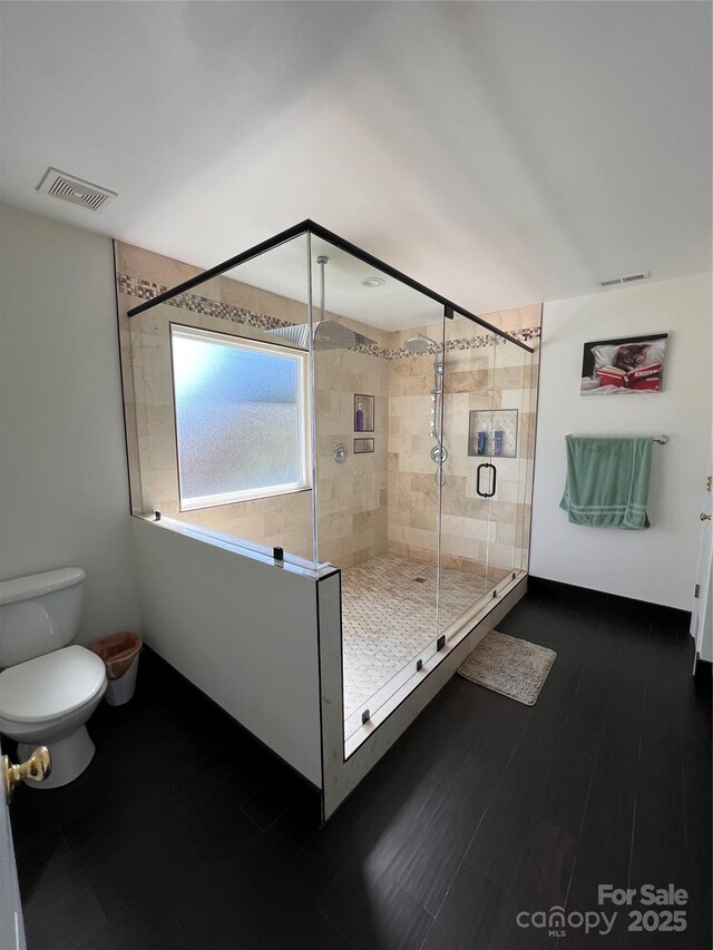 435 Riverwalk Dr NW, Concord, NC 28027 - full bathroom with toilet, a stall shower, and wood finished floors
