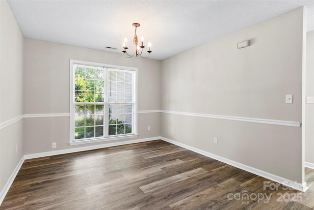 370 Running Briar Rd, Fletcher, NC 28732 - empty room with a chandelier, wood finished floors, and baseboards