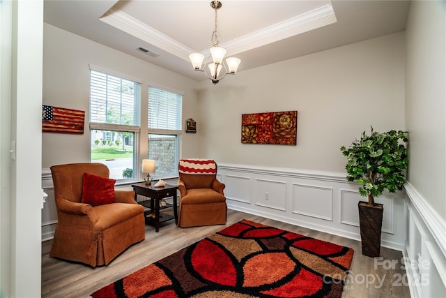 6038 Durango Way, Denver, NC 28037 - sitting room featuring ornamental molding, a raised ceiling, wood finished floors, wainscoting, and a chandelier