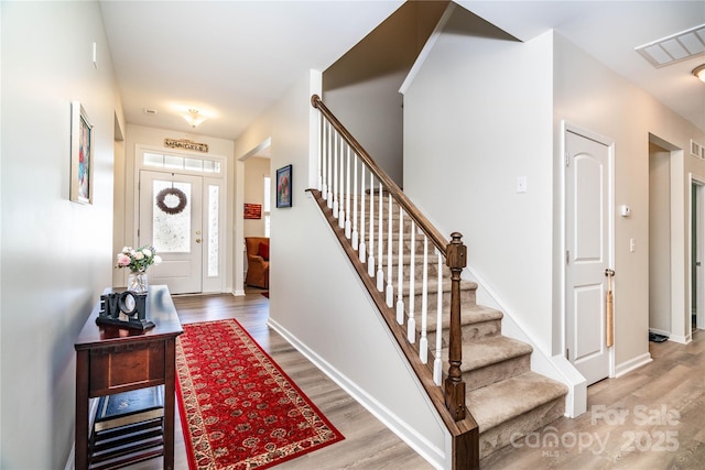 6038 Durango Way, Denver, NC 28037 - entryway with wood finished floors, stairs, and baseboards