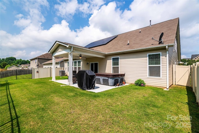 6038 Durango Way, Denver, NC 28037 - rear view of house with a hot tub, ceiling fan, a patio, roof mounted solar panels, and central AC