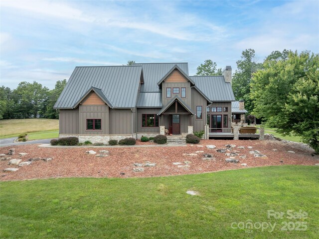 4862 Pinnacle Mountain Rd, Zirconia, NC 28790 - back of property featuring a yard, a chimney, a standing seam roof, a metal roof, and board and batten siding
