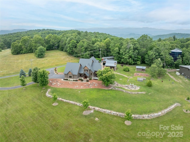 4862 Pinnacle Mountain Rd, Zirconia, NC 28790 - aerial view of property and surrounding area with a heavily wooded area and a mountain backdrop