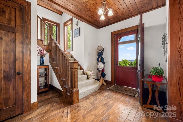 4862 Pinnacle Mountain Rd, Zirconia, NC 28790 - foyer entrance featuring hardwood / wood-style floors, stairway, wooden ceiling, healthy amount of natural light, and a chandelier