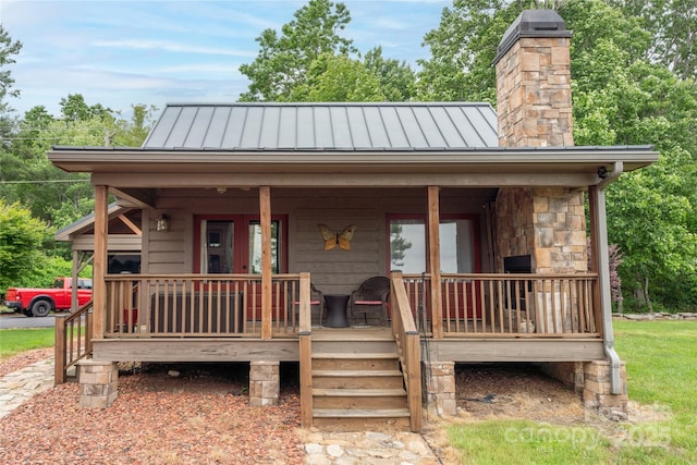 4862 Pinnacle Mountain Rd, Zirconia, NC 28790 - view of front facade featuring a standing seam roof, a metal roof, a chimney, and covered porch