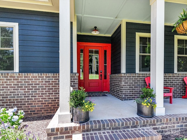 164 Twin Sisters Ln, Mooresville, NC 28117 - doorway to property featuring a porch and brick siding