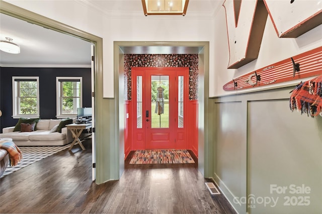164 Twin Sisters Ln, Mooresville, NC 28117 - entrance foyer with a decorative wall, crown molding, dark wood-style floors, and wainscoting