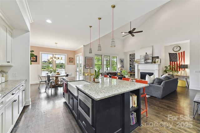 164 Twin Sisters Ln, Mooresville, NC 28117 - kitchen featuring a sink, dark wood-style flooring, dark cabinetry, white cabinets, and recessed lighting