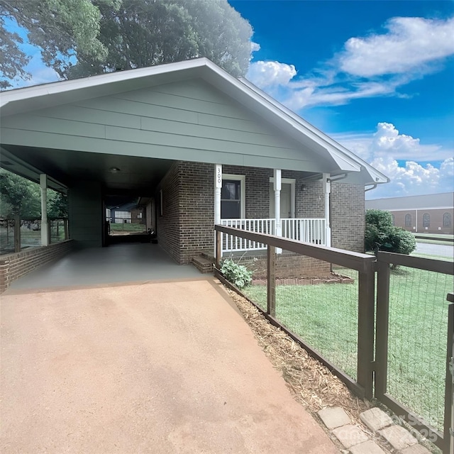 300 N Watterson St, Kings Mountain, NC 28086 - view of front facade featuring concrete driveway, brick siding, and covered porch