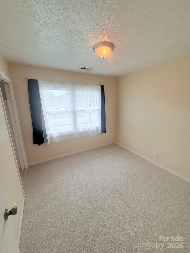 300 N Watterson St, Kings Mountain, NC 28086 - spare room with light carpet, a textured ceiling, and baseboards