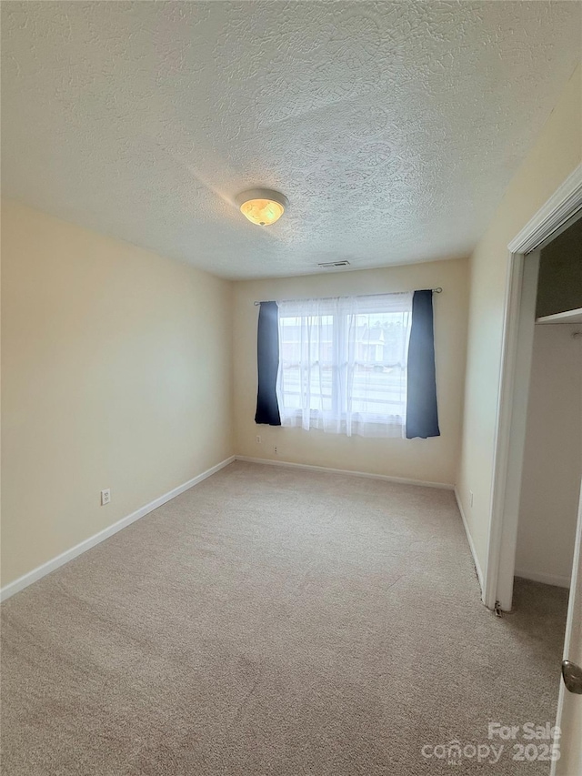 300 N Watterson St, Kings Mountain, NC 28086 - unfurnished bedroom with carpet, a textured ceiling, and baseboards