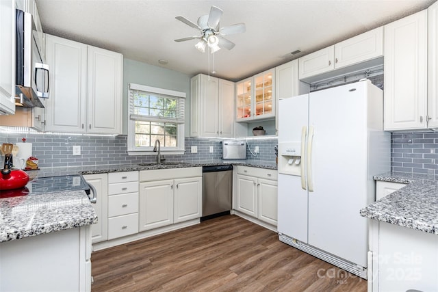 1626 Riverglenn Ct, Rock Hill, SC 29732 - kitchen featuring appliances with stainless steel finishes, decorative backsplash, a ceiling fan, a sink, and white cabinetry